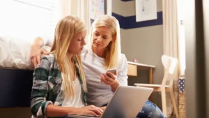 A mother gently guiding her daughter to make a better choice.