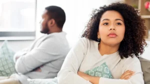 A married couple experiencing intimacy issues looking away from each other.