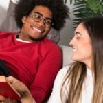 A couple reading and reflecting on what they are reading - 12 Recommended Books on Effective Couples Communication