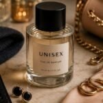 A close-up of an elegant unisex fragrance bottle beside a man's and woman's accessories—such as a watch, earrings, or clutch—subtly portraying the best unisex colognes for first dates in this article.